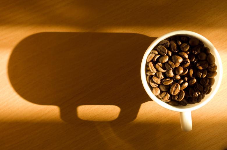 Free stock image of Cup with coffee beans - Shadow created by 2happy