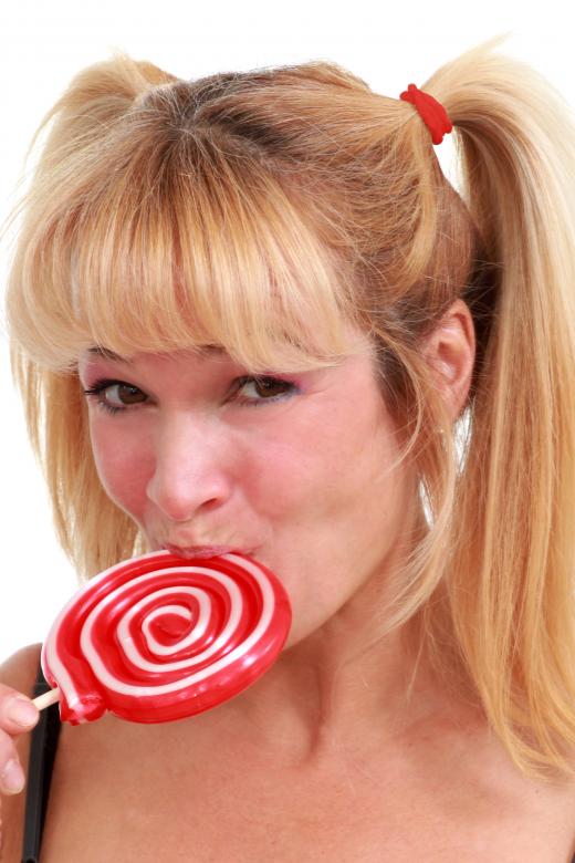 Free stock image of Woman enjoying a lollipop created by Val Lawless