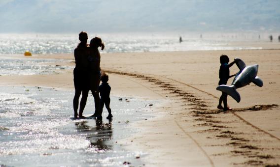 Happy family on the beach - Free Stock Photo