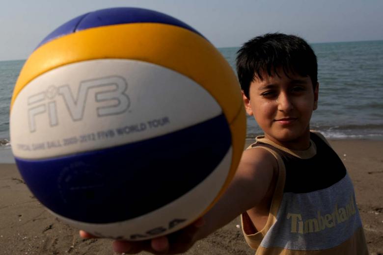 Free stock image of Boy holding a volleyball created by basem