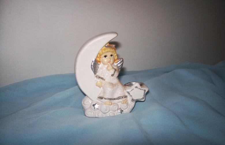 Free stock image of Angel on moon created by Laura Dambite