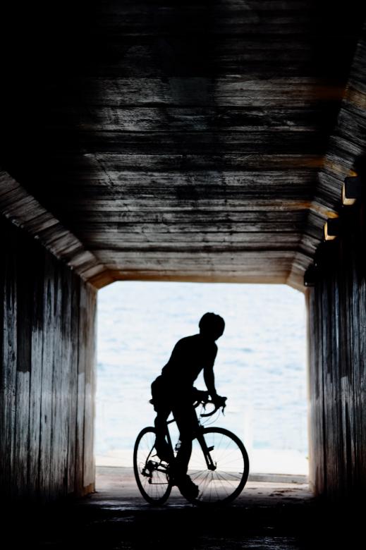 Free stock image of Cyclist in tunnel created by Joses Tirtabudi