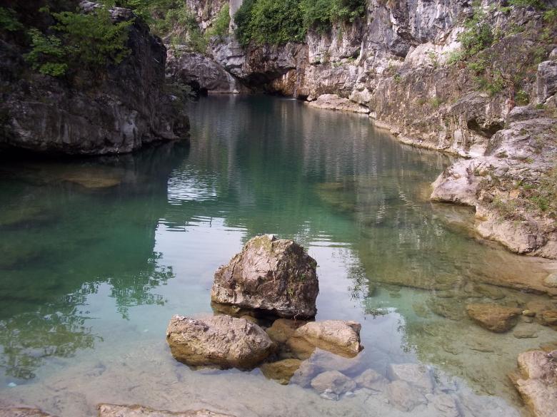 Free stock image of Rocks emerge from the water created by francesco scanagatta