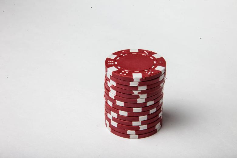Free stock image of Red poker chips on white background created by Jared Davidson