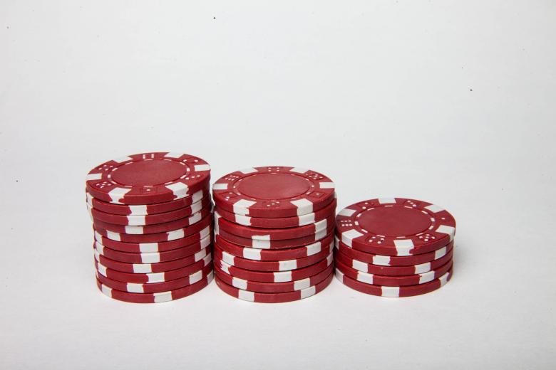 Free stock image of Red poker chips on white background created by Jared Davidson