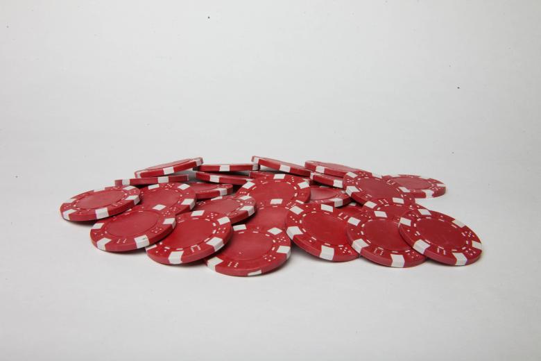 Free stock image of Red poker chips on white background created by Jared Davidson
