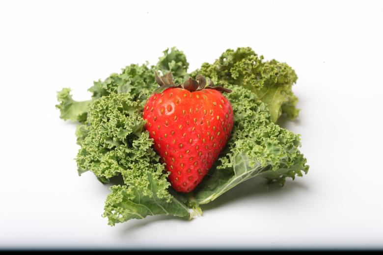 Free stock image of Red Strawberry on kale created by Jared Davidson