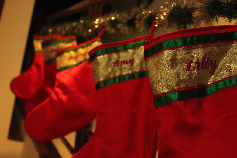 Free stock image of Red Christmas stockings hanging created by Katriona Galahad