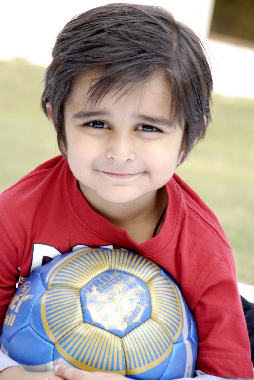 Free stock image of Cute Child With Football created by Bilal Aslam