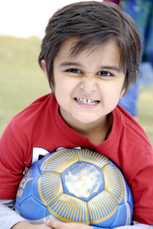 Free stock image of Cute Child With Football created by Bilal Aslam