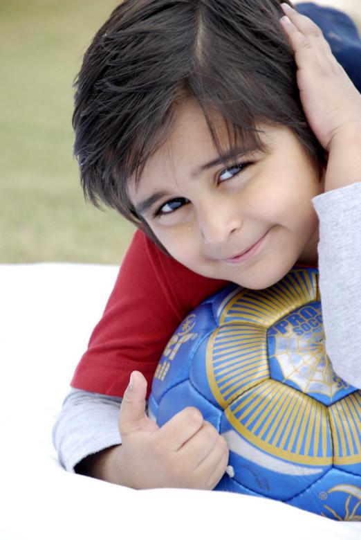 Free stock image of Cute Kid With Football created by Bilal Aslam