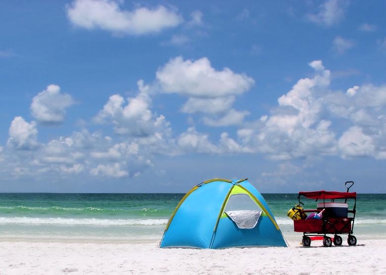 Free stock image of A tent and buggy on a beach created by Benjamin Miller