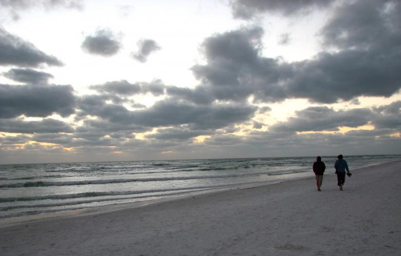 Free stock image of A couple walking on the beach created by Benjamin Miller