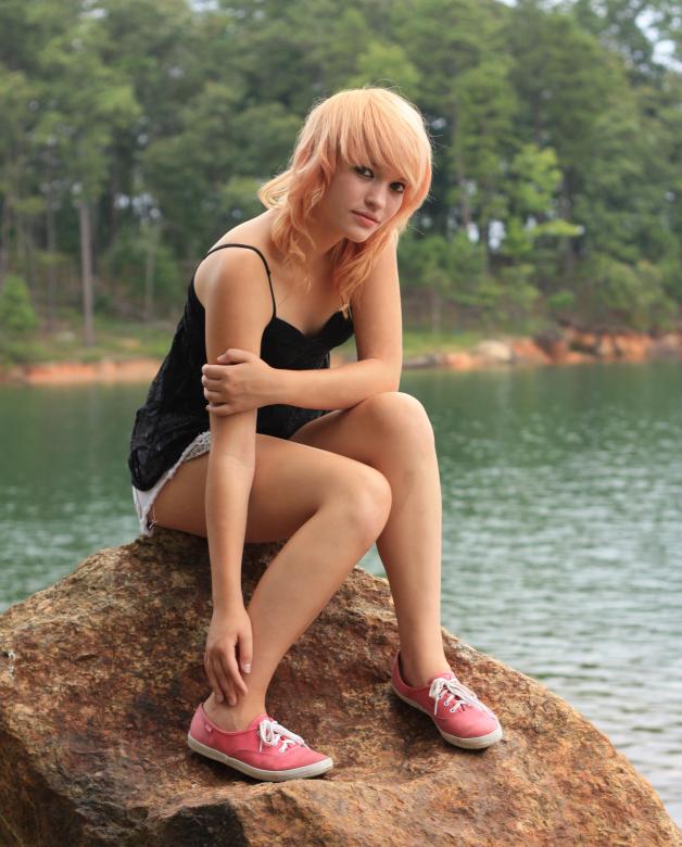 Free stock image of A beautiful young woman posing on a rock created by Benjamin Miller