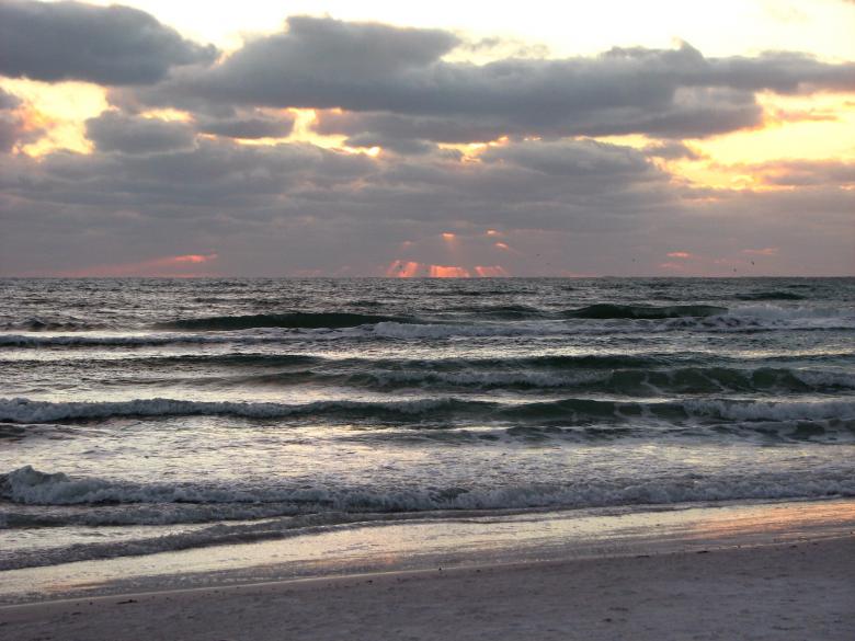 Free stock image of A cloudy sunset over the ocean created by Benjamin Miller