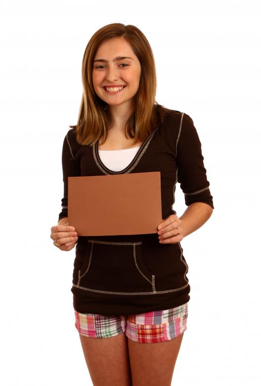 Free stock image of Young girl posing with a blank sign created by Benjamin Miller