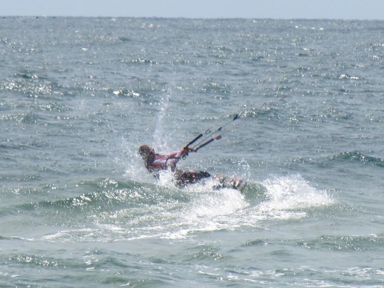Free stock image of A kitesurfer at sea created by Boris Kyurkchiev