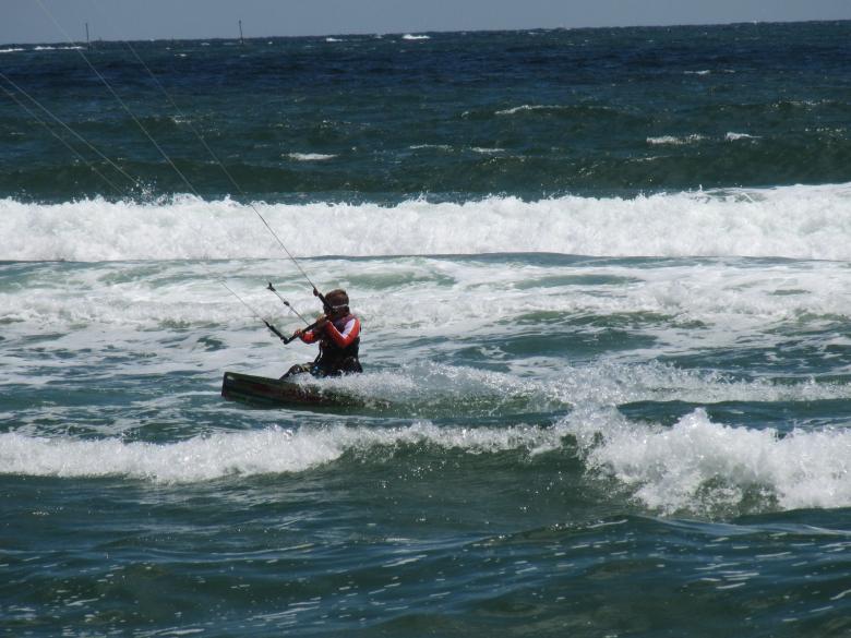 Free stock image of A kitesurfer at sea created by Boris Kyurkchiev