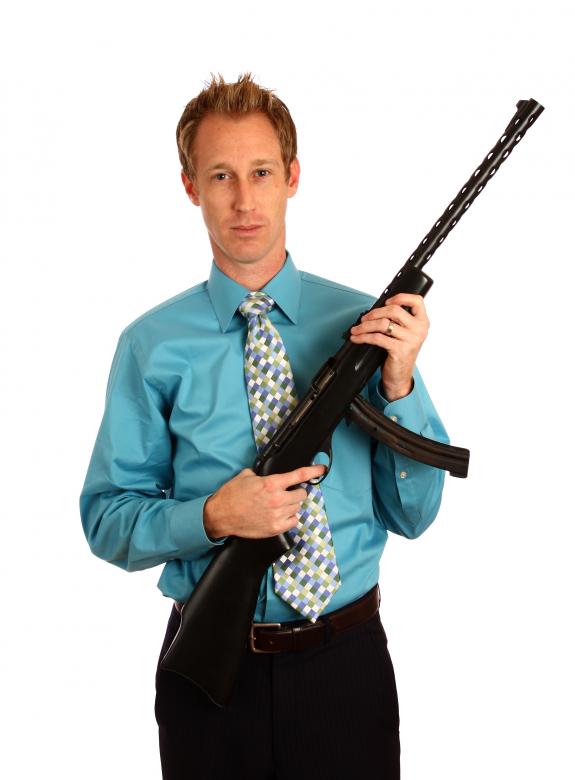 Free stock image of A young businessman holding a rifle created by Benjamin Miller