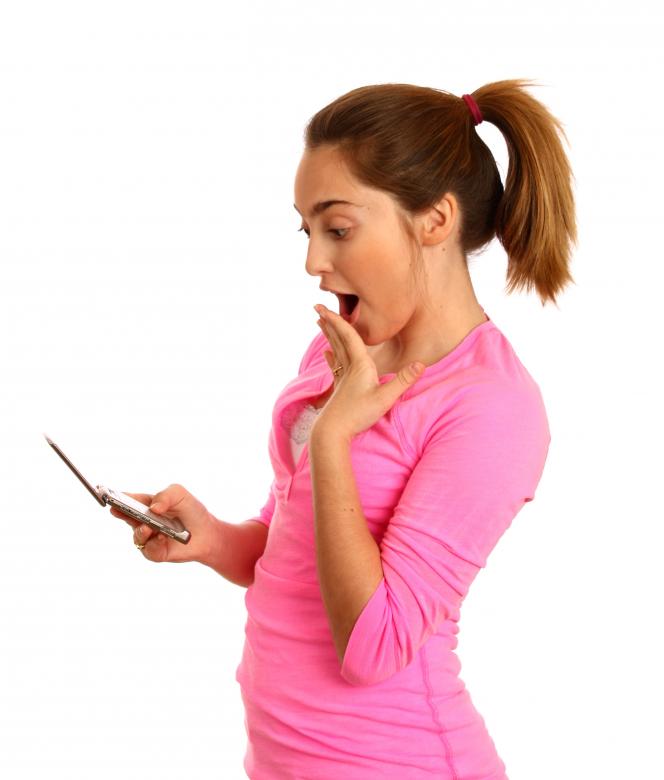 Free stock image of Young girl texting on a cell phone created by Benjamin Miller