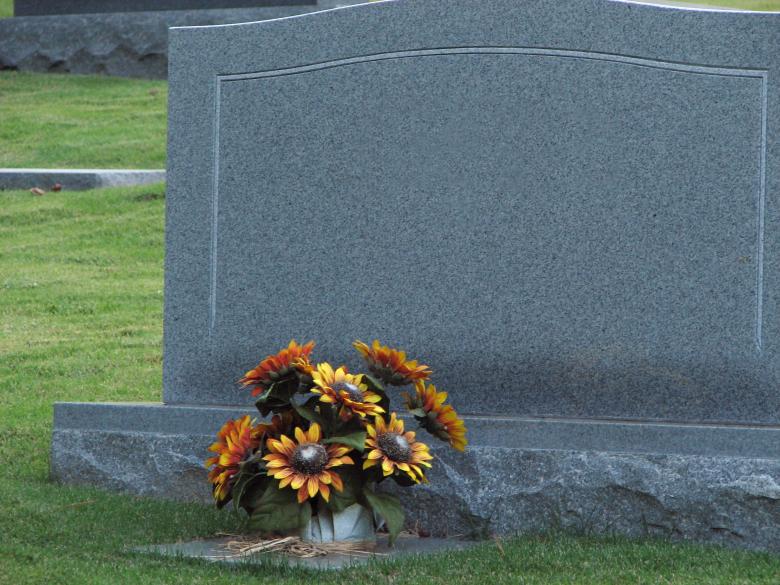 Free stock image of A blank tombstone with flowers created by Benjamin Miller