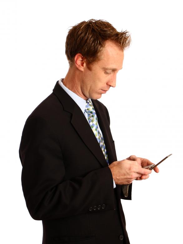Free stock image of A businessman texting on a cell phone created by Benjamin Miller