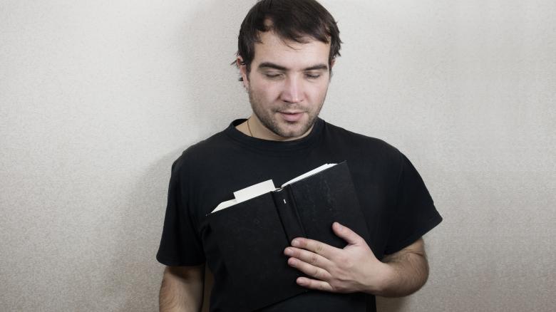 Free stock image of Handsome young man reading created by Mudretsov Olexandr