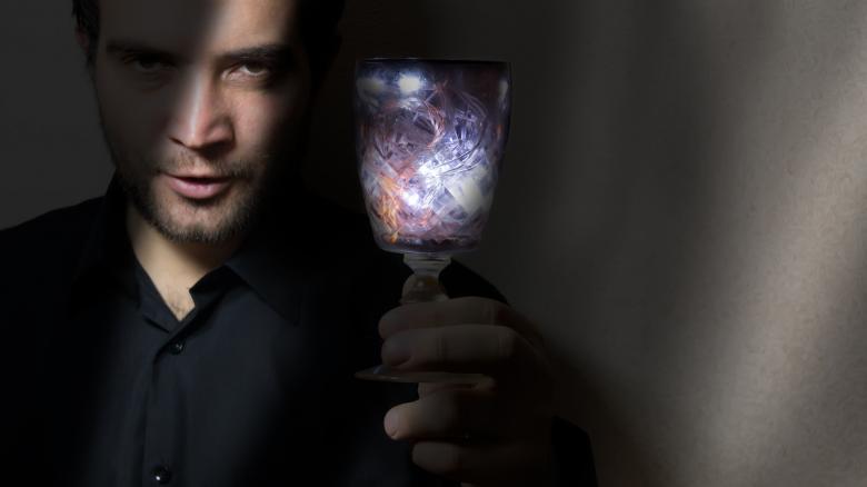 Free stock image of man holding wine glass created by Mudretsov Olexandr