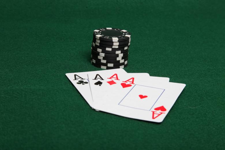 Free stock image of Stack of black poker chips with four ace created by Jared Davidson
