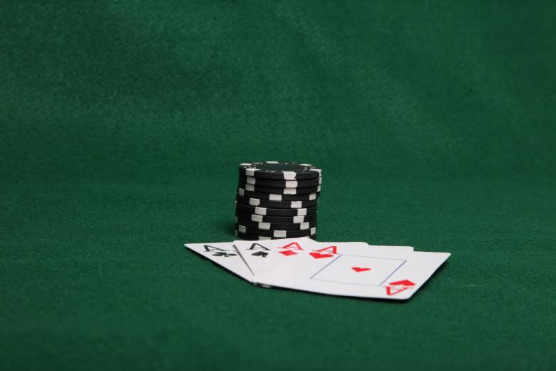 Free stock image of Stack of black poker chips with four ace created by Jared Davidson