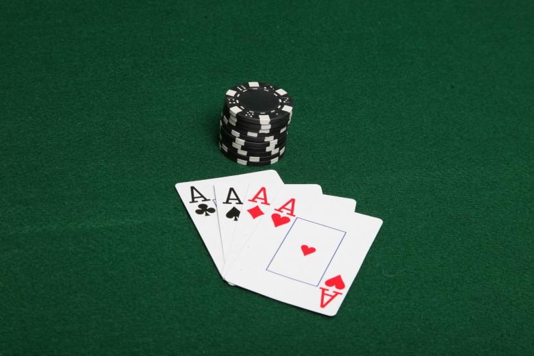 Free stock image of Stack of black poker chips with four ace created by Jared Davidson