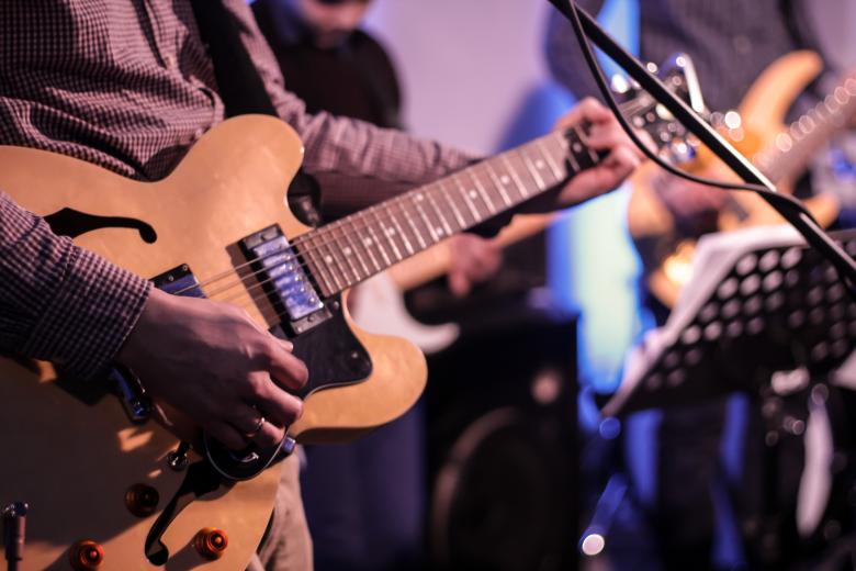 Free stock image of Guitar Player created by Janis Urtans