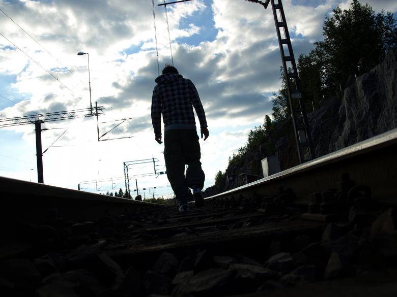 Free stock image of Man walking in railroad created by Marko Mäkinen