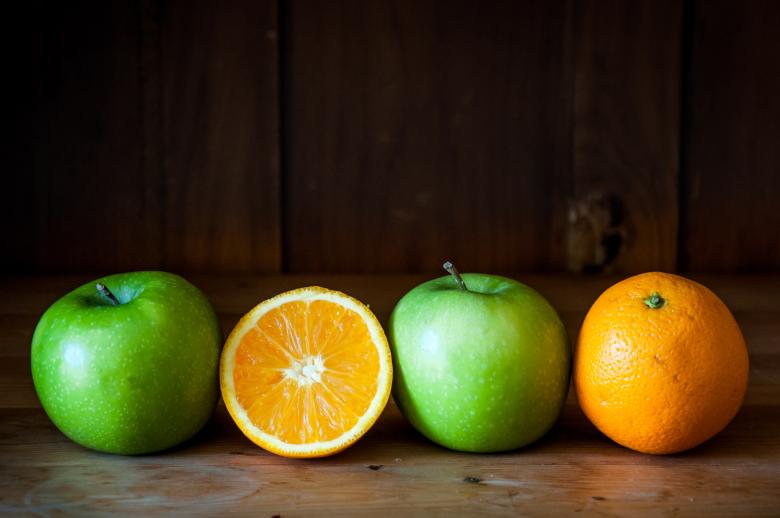 Free stock image of Apple and orange fruit on brown wood created by Luka