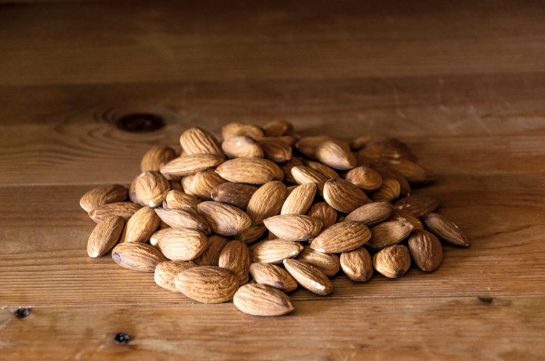 Free stock image of Almonds nuts on rustic wood created by Luka