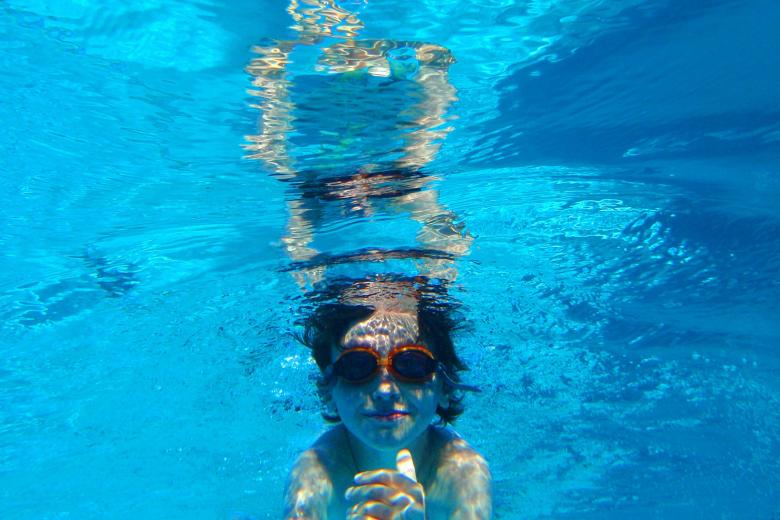Free stock image of Child swimming underwater created by Jack Moreh