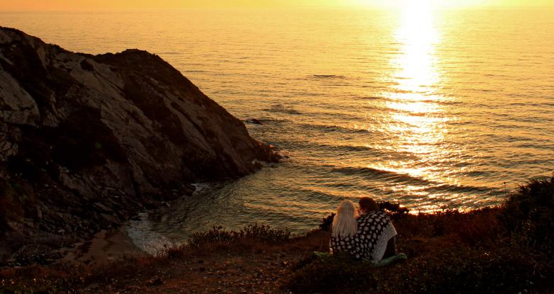 Free stock image of Two lovers watching a fiery sunset created by Jack Moreh