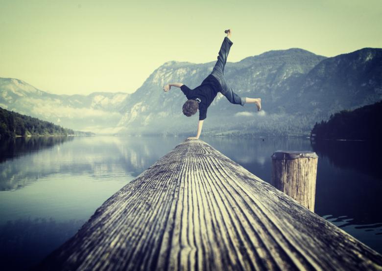 Free stock image of Young boy handstanding on jetty created by Jack Moreh