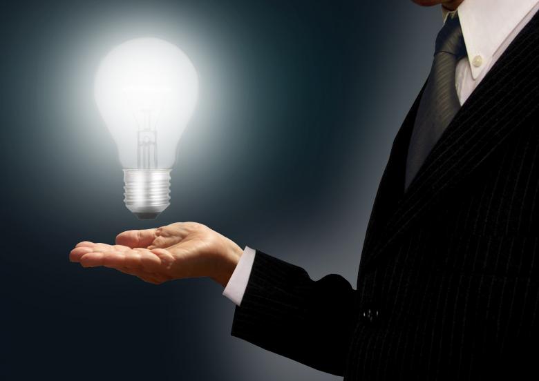 Free stock image of Businessman holding a lightbulb - Ideas and creativity concept created by Jack Moreh