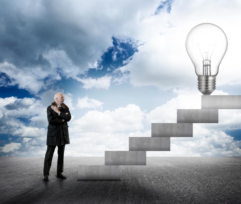 Free stock image of Businessman facing stairs with lightbulb created by Jack Moreh