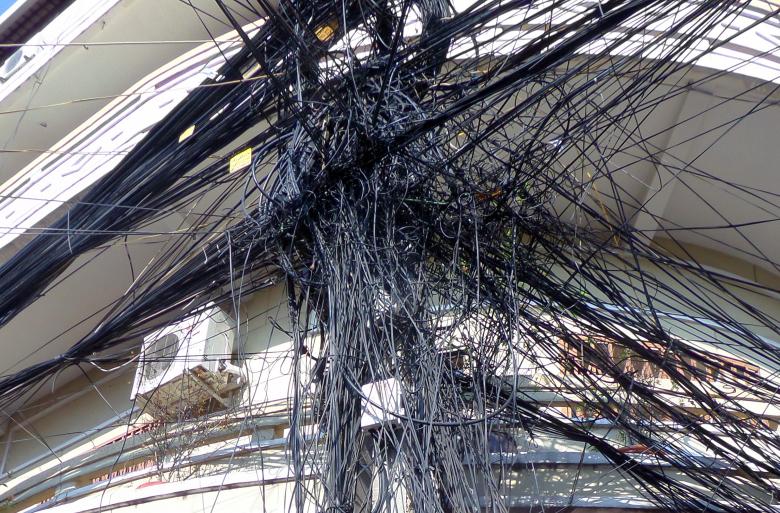 Free stock image of Chaotic Cambodian street cabling created by Chas Mac