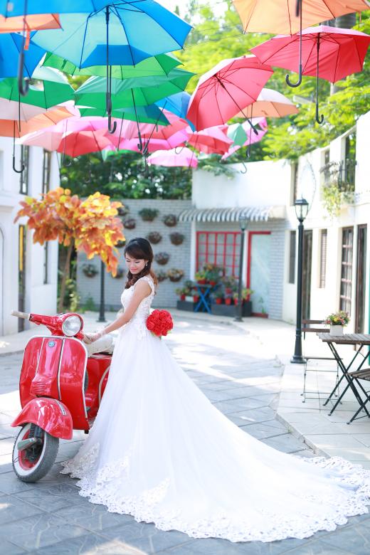 Free stock image of Bride posing with red scooter created by Nga Le
