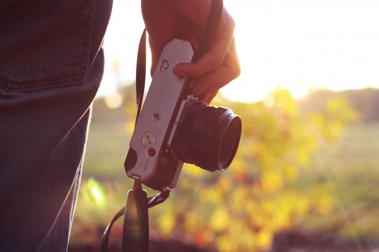 Free stock image of Hand holding a camera created by Unsplash