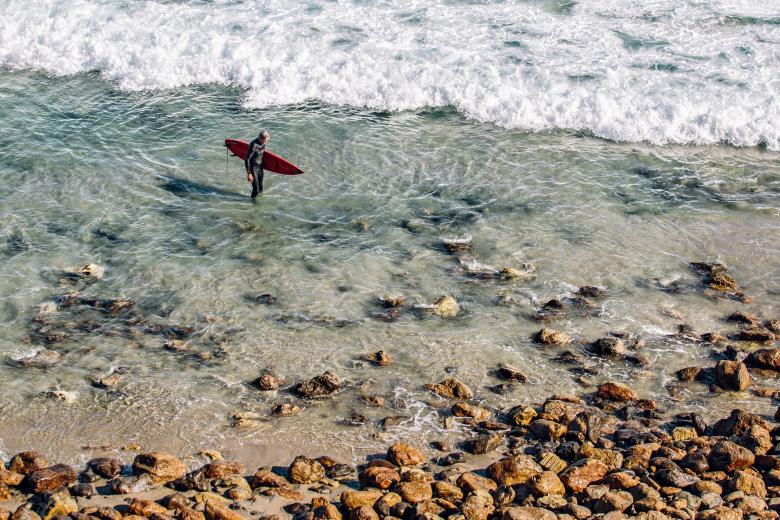 Free stock image of Surfer on the Shore created by Unsplash