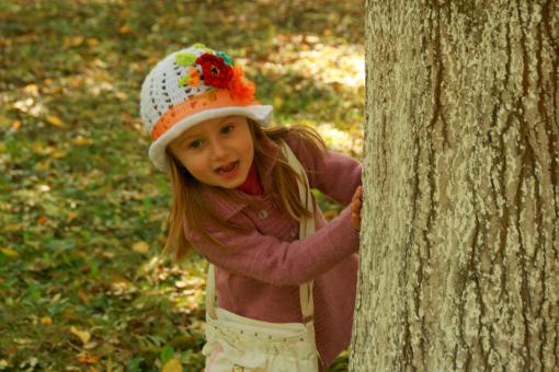 Free Stock Photo of Girl Behind the Tree