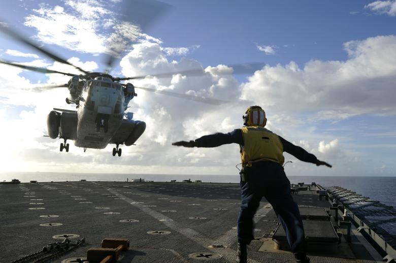 Free stock image of Sailor Directing Helicopter created by Pixabay