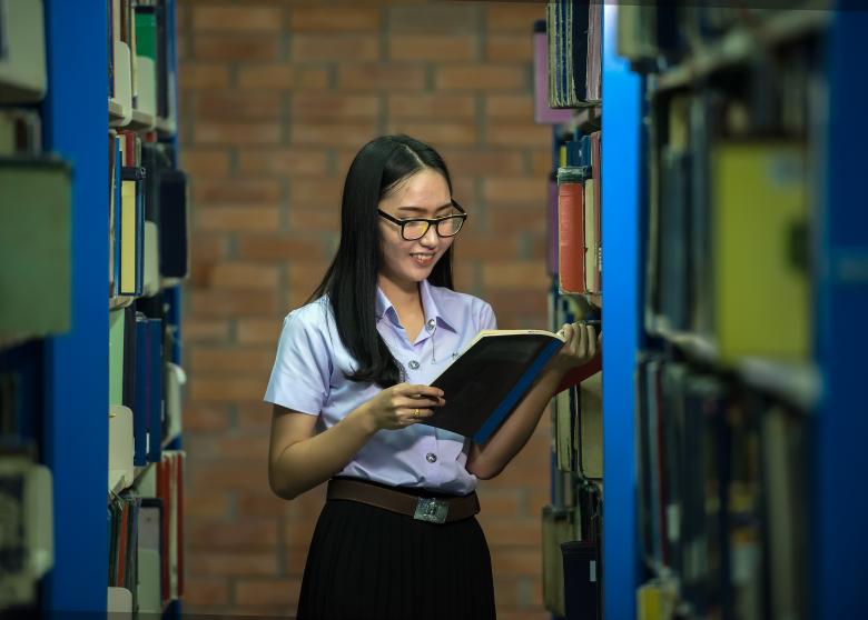 Free stock image of Girl in the Library created by Pixabay