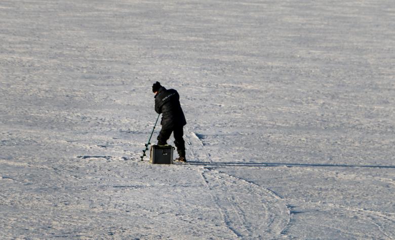 Free stock image of Ice fisherman with a drill created by Janis Urtans