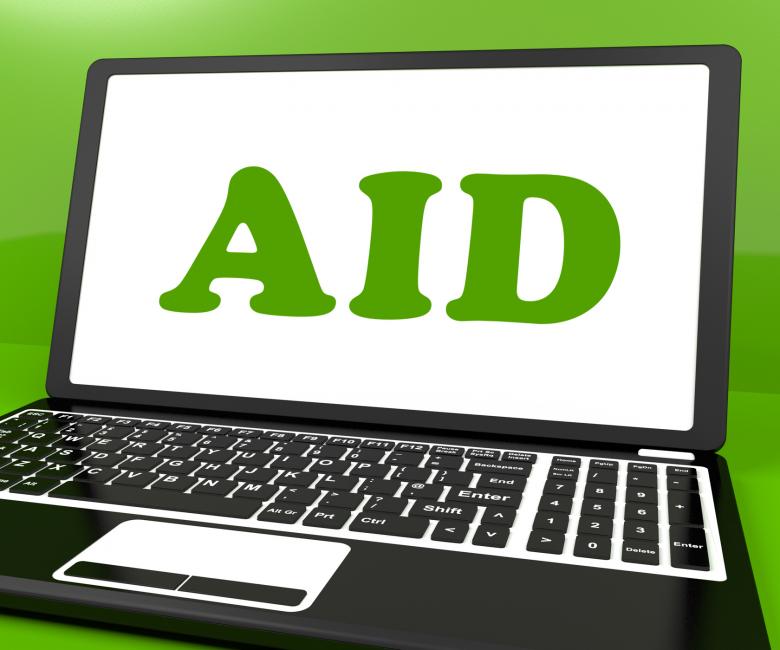 Free stock image of Aid On Laptop Shows Assisting Aiding Help Or Relief created by Stuart Miles