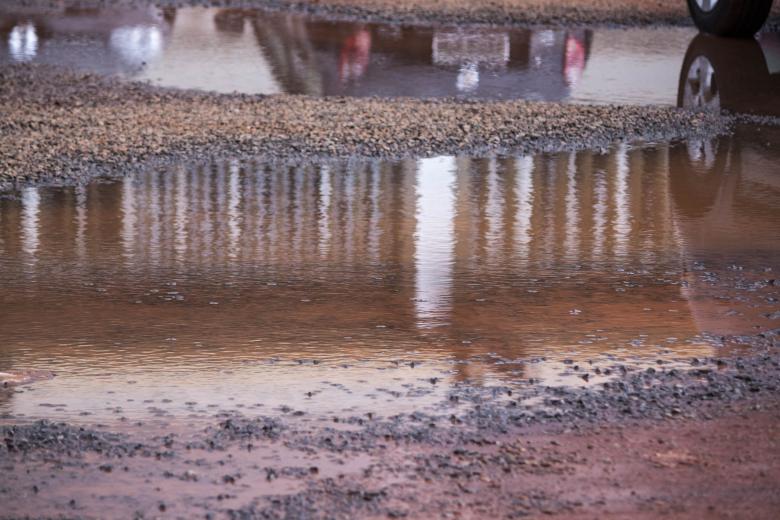 Free stock image of Water Puddle in Parking Lot created by Eduardo Soares Bogosian